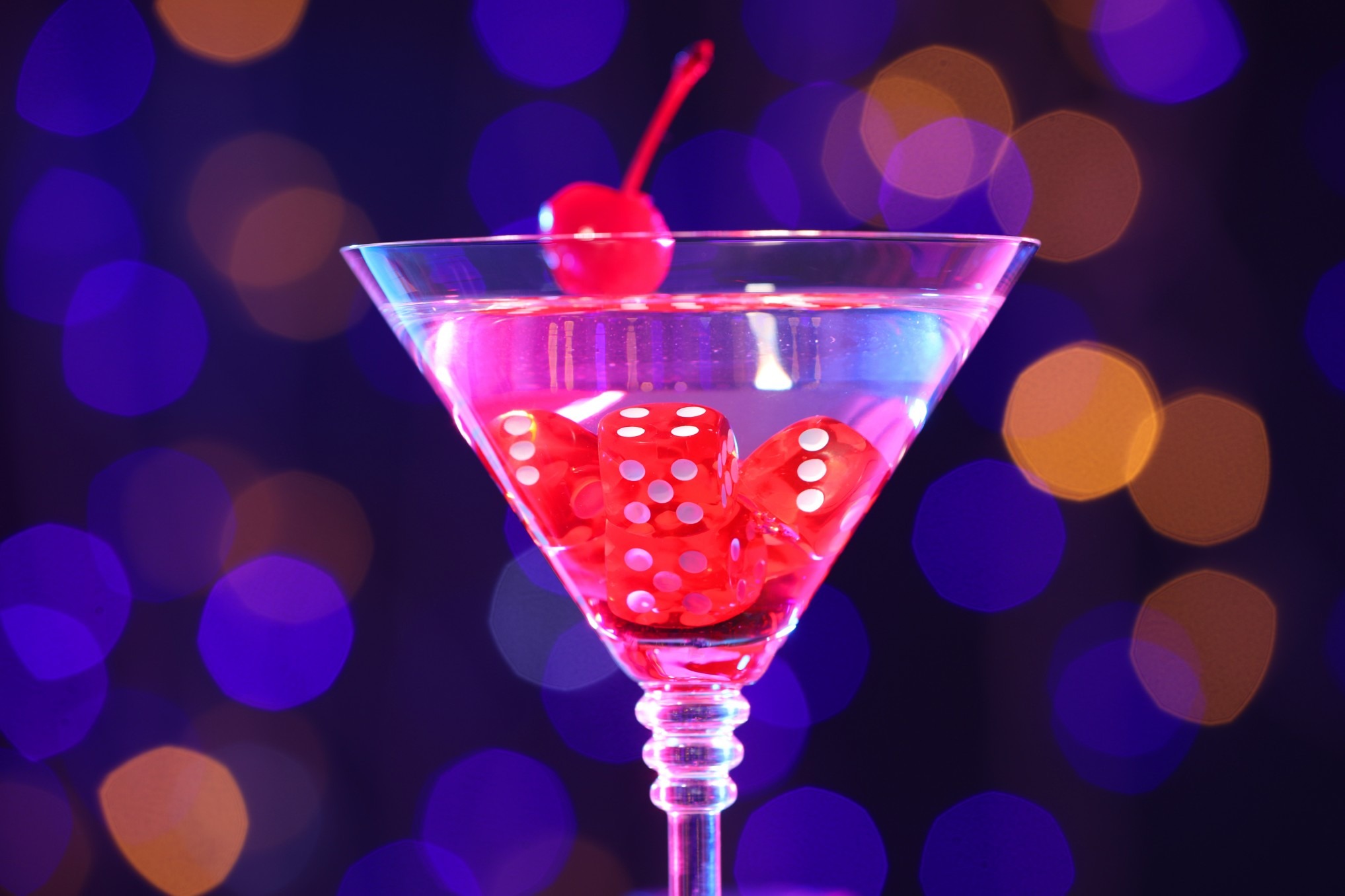 A New Year's cocktail drink with dice as ice cubes.